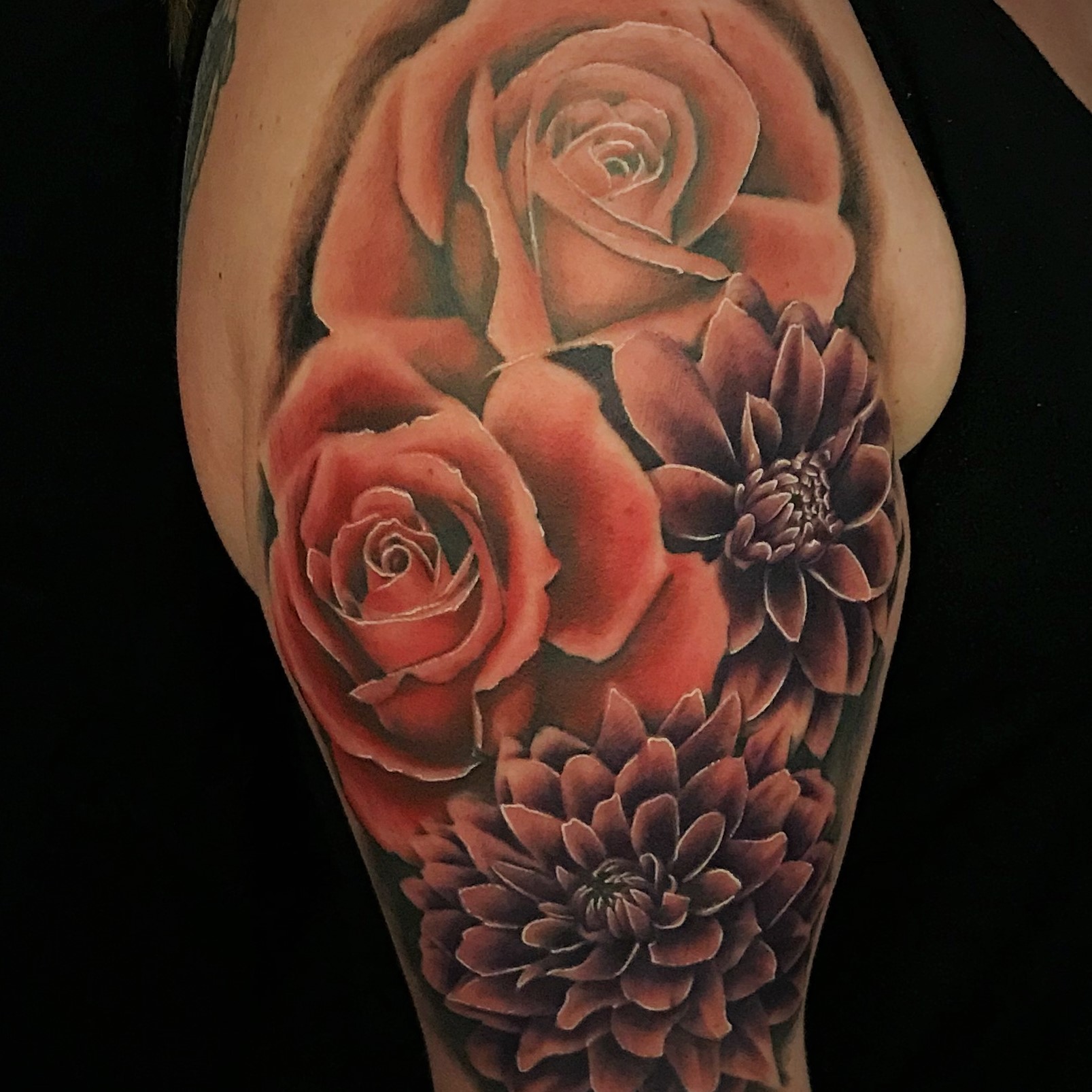 Pink Roses and Purple Dahlia flower upper arm and shoulder tattoo created by tattoo artist Alan Lott of Sacred Mandala Studio in Durham, NC.
